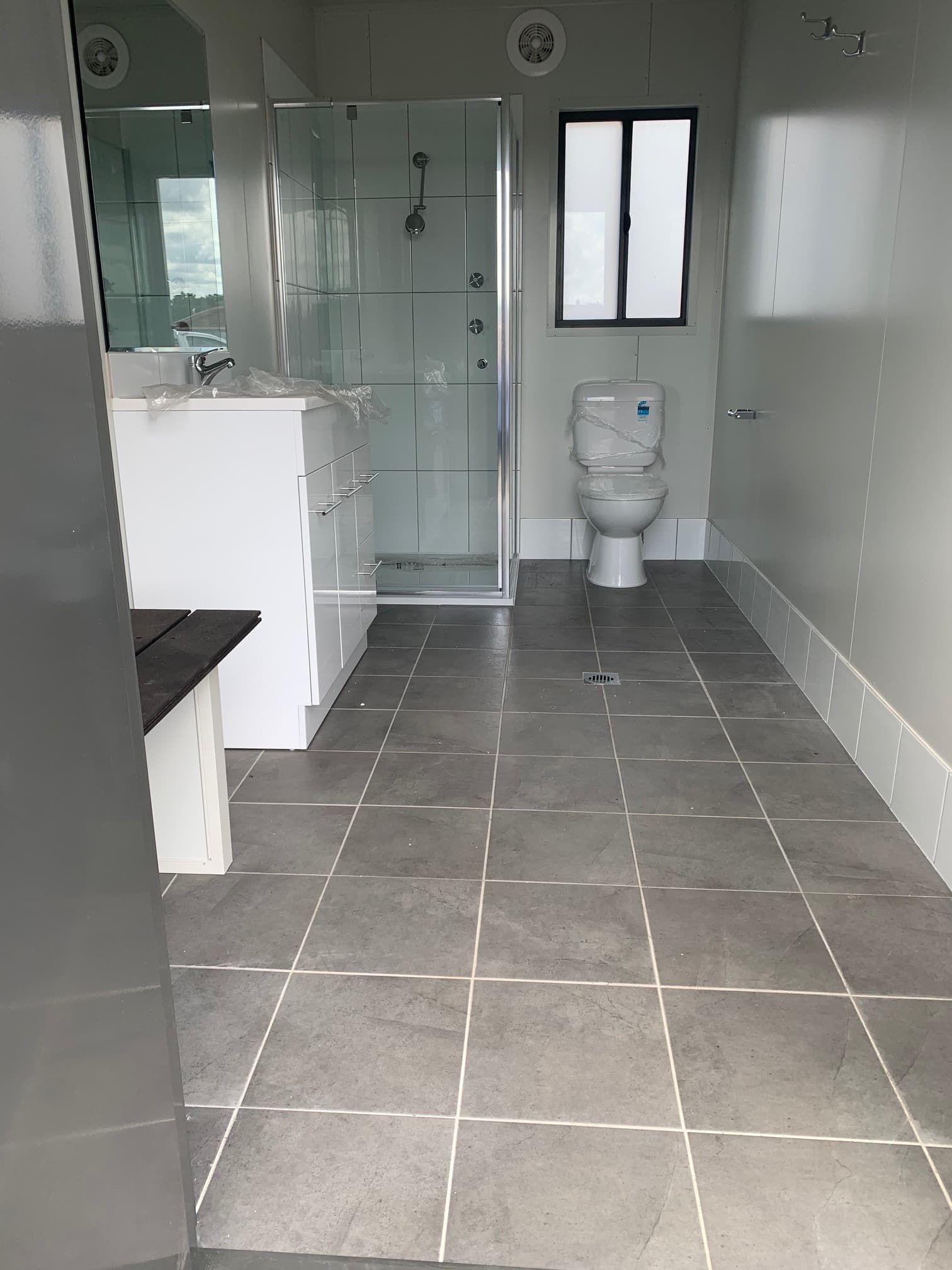 Newly Built Bathroom With Glass Divider and Vanity — OSM Transportables In Dubbo, NSW