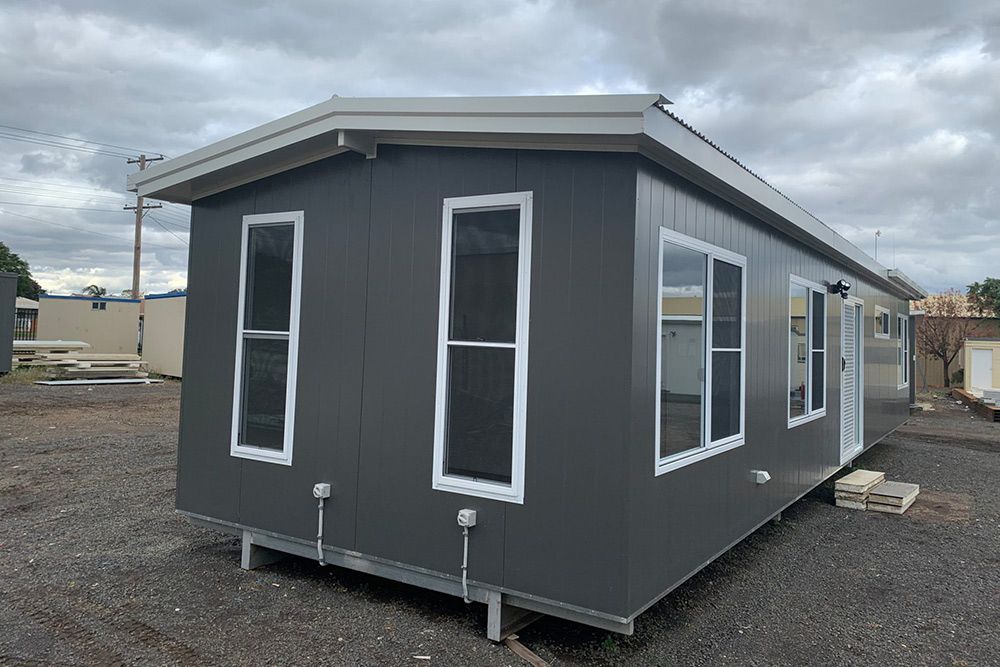 Side View of the Dark Portable House With Window Glass — OSM Transportables In Dubbo, NSW