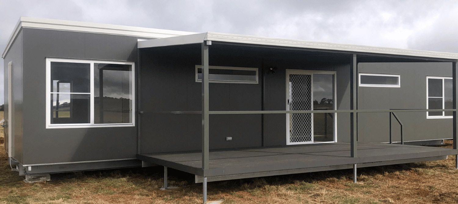 Dark Grey House Featuring Sliding Glass Windows and Doors for a Modern and Stylish Touch — OSM Transportables In Dubbo, NSW