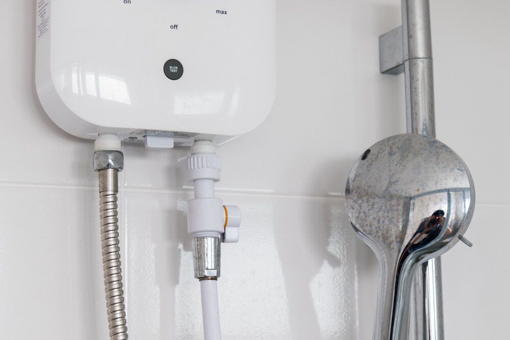 White Electric Water Heater — VR Marsden Plumbing in Woolgoolga, NSW