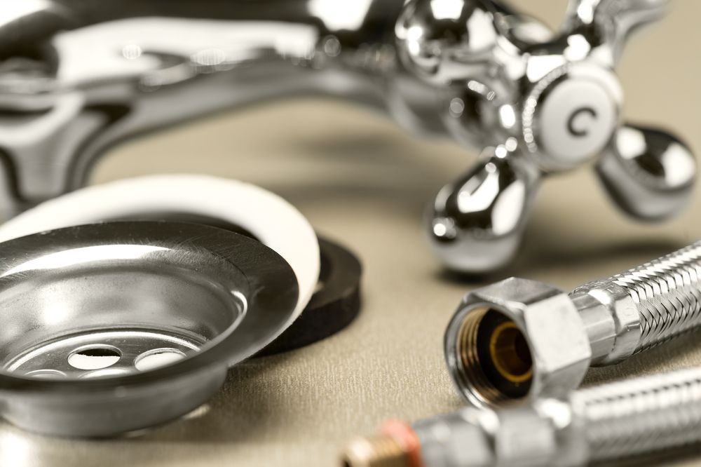 Chrome faucet and sink drain components, ready for installation — VR Marsden Plumbing in Emerald Beach, NSW