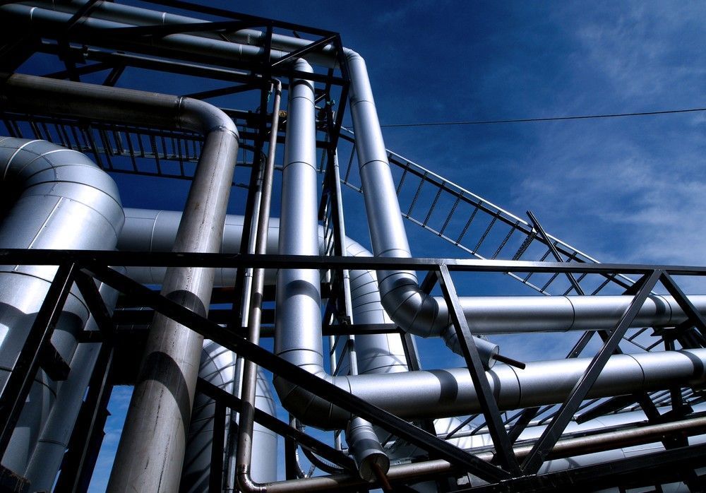 Metal Pipes and Walkways Against a Blue Sky. Industrial Setting — VR Marsden Plumbing in Red Rock, NSW