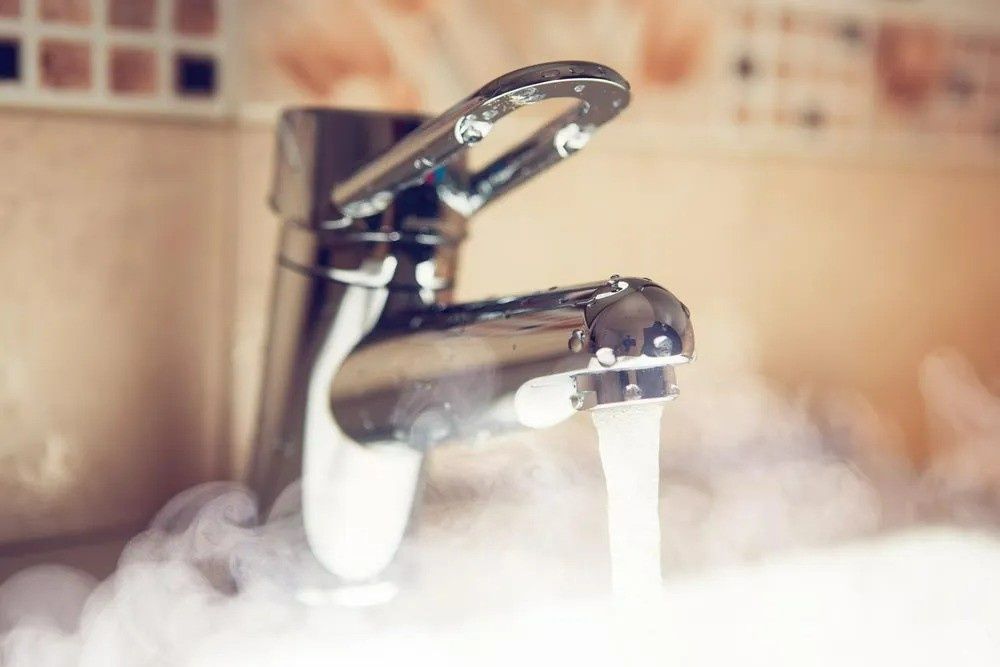 Faucet With Steam, Running Hot Water in a Sink. Chrome Fixtures, Tiled Backsplash — VR Marsden Plumbing in Red Rock, NSW