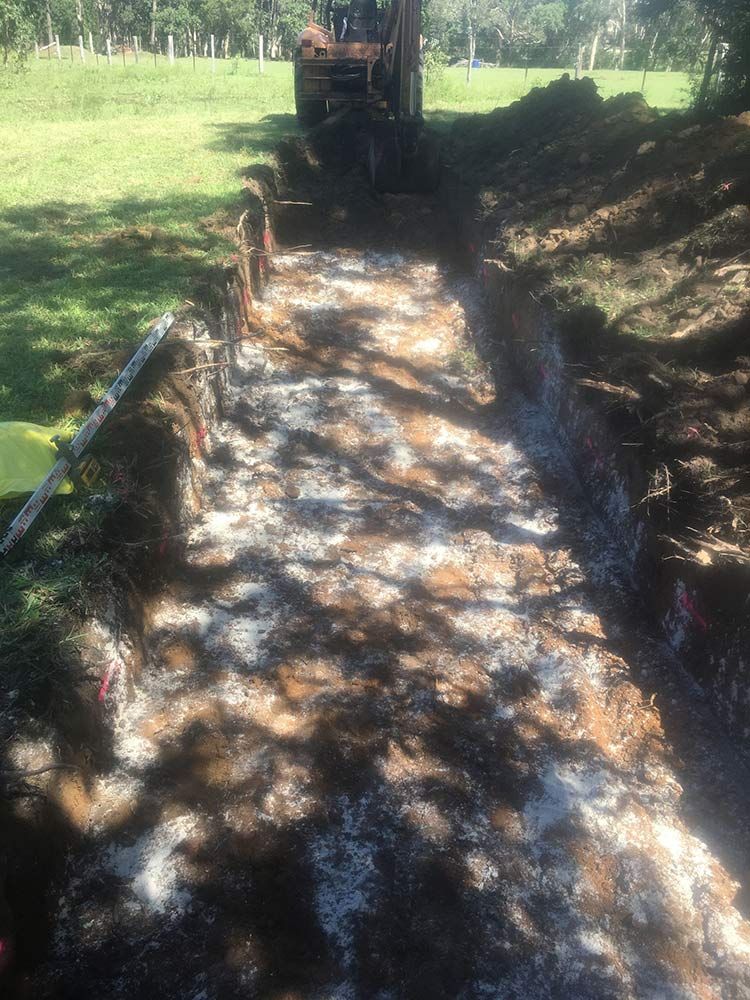 Dug Trench With Excavator in a Grassy Area — VR Marsden Plumbing in Woolgoolga, NSW