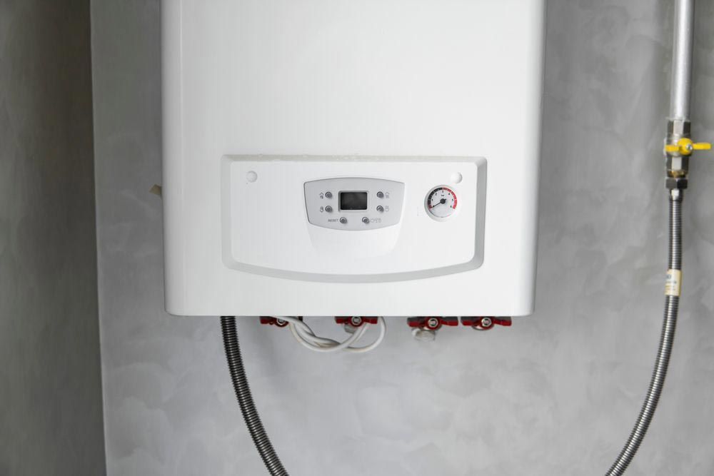 Wall-Mounted Gas Boiler with Digital Display, Pressure Gauge, and Connected Pipes — VR Marsden Plumbing in Red Rock, NSW