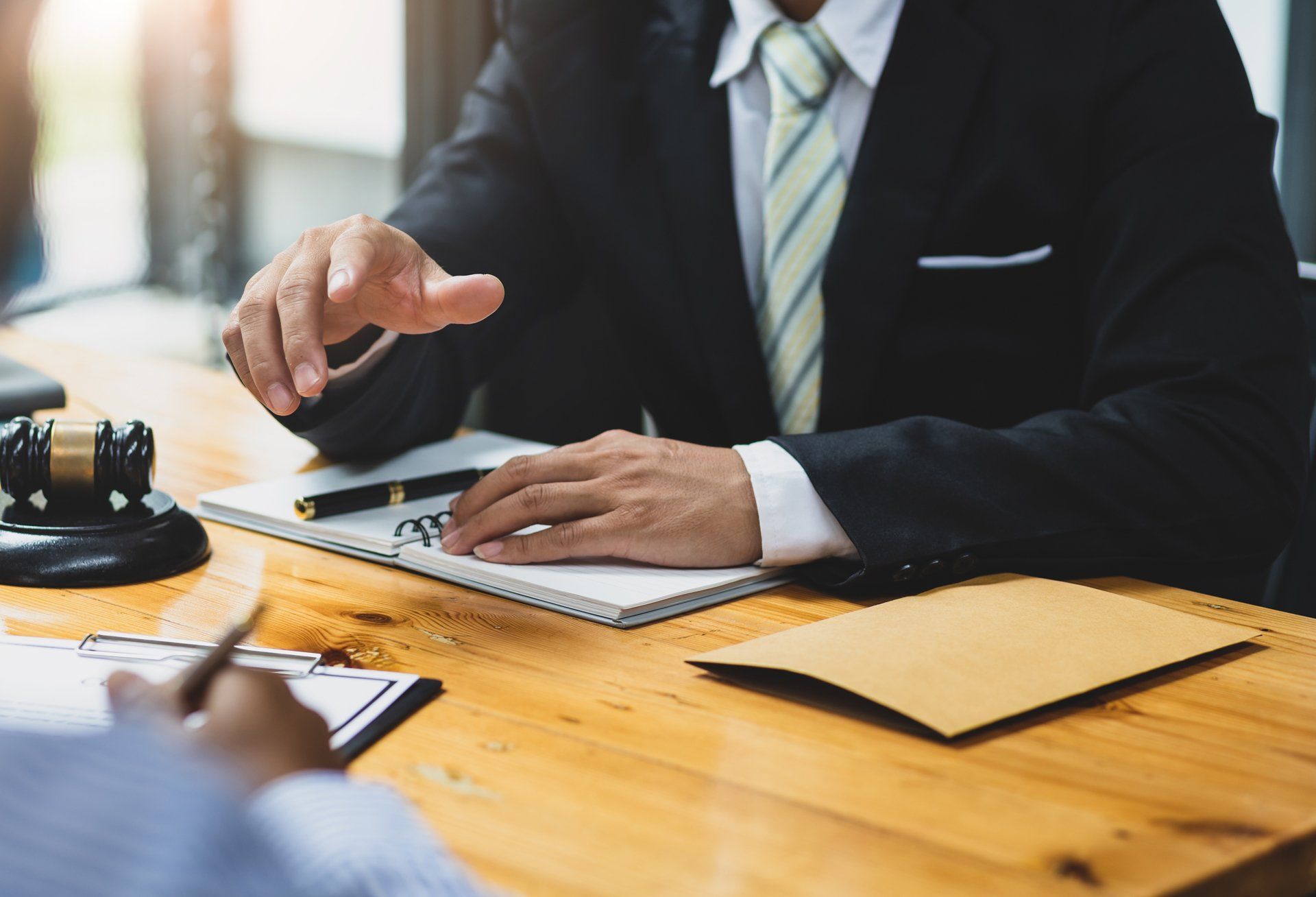 Lawyer and His Client Signing Legal Documents