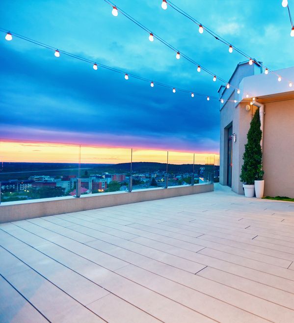 An Outdoor Deck with a view of a Sunset — Hart Projects Wollongong In Dapto, NSW