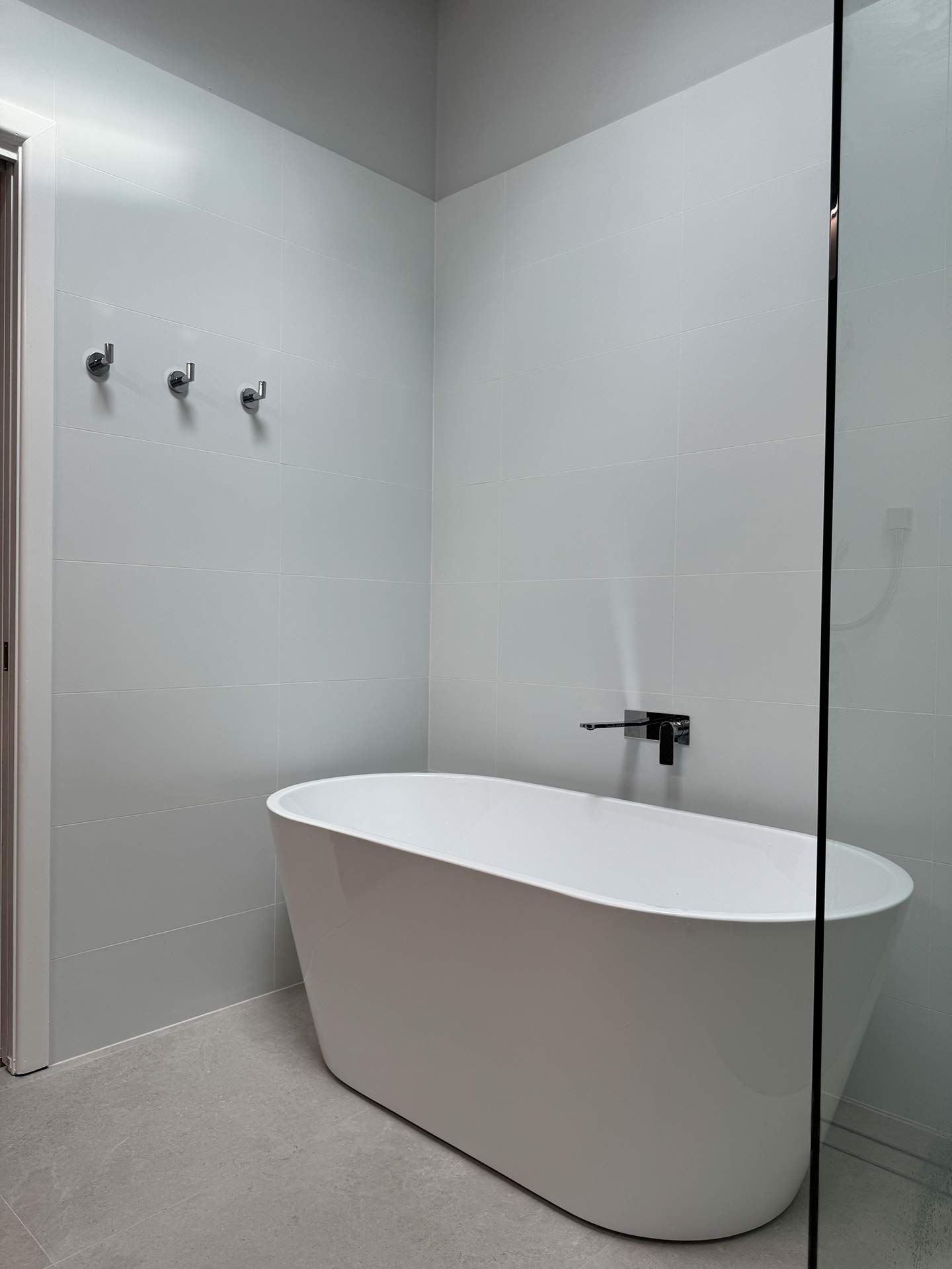 A Bathroom With a Bathtub and a Walk in Shower — Hart Projects Wollongong In Dapto, NSW