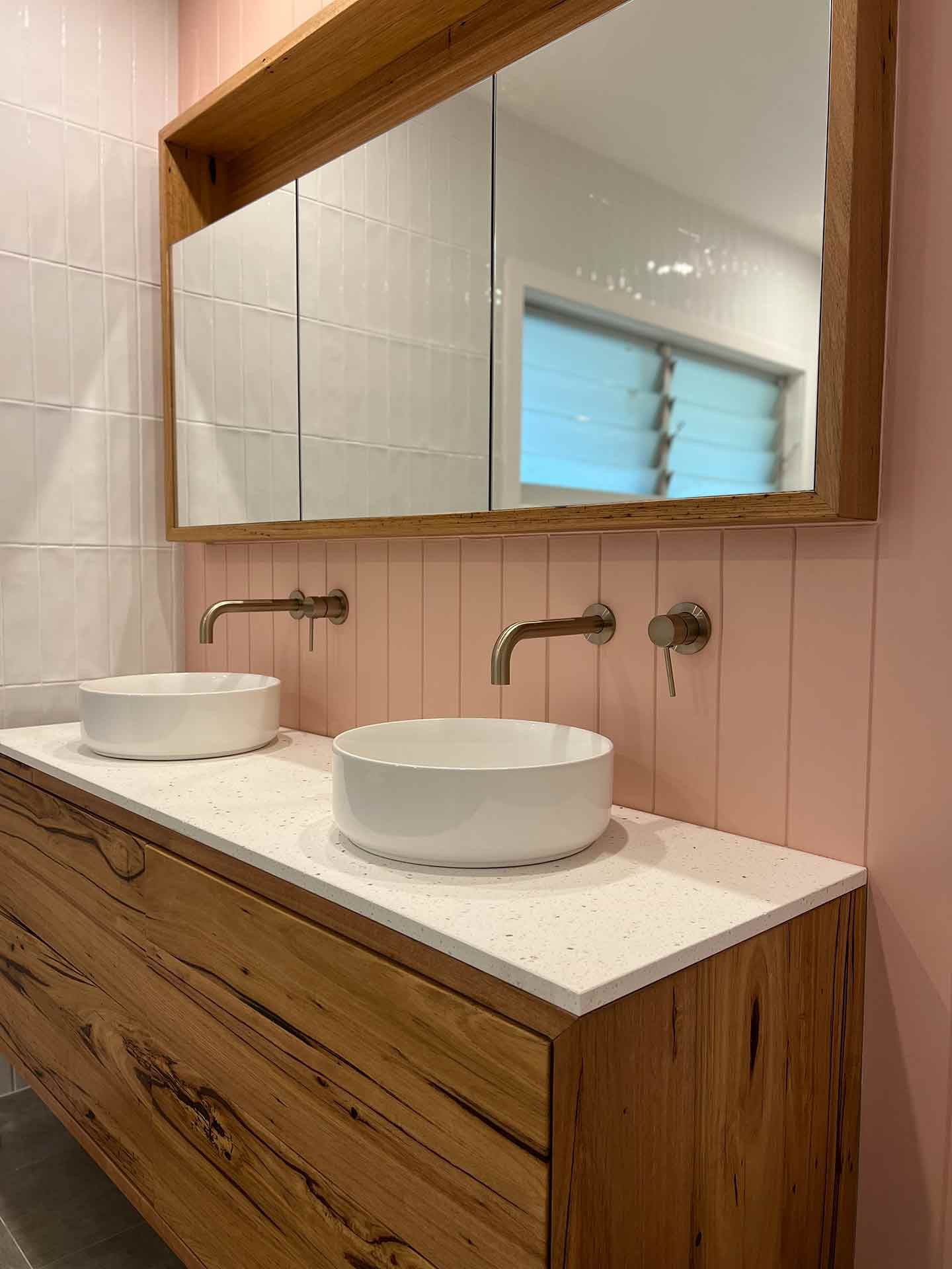 A Bathroom With Two Sinks and a Large Mirror — Hart Projects Wollongong In Thirroul, NSW