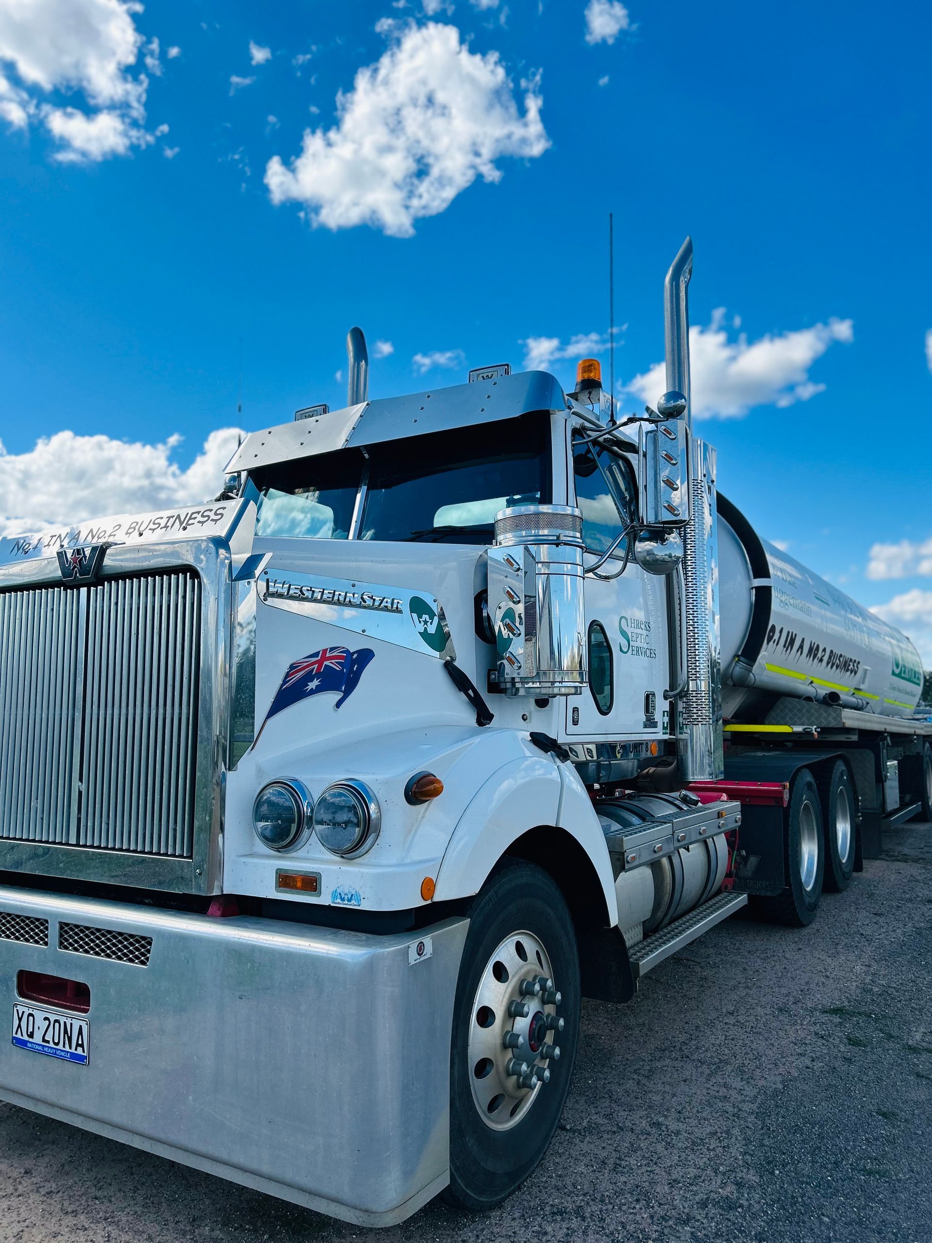 White Semi-truck With Chrome Grille — Shreks Septic Services in Gowrie Junction, QLD
