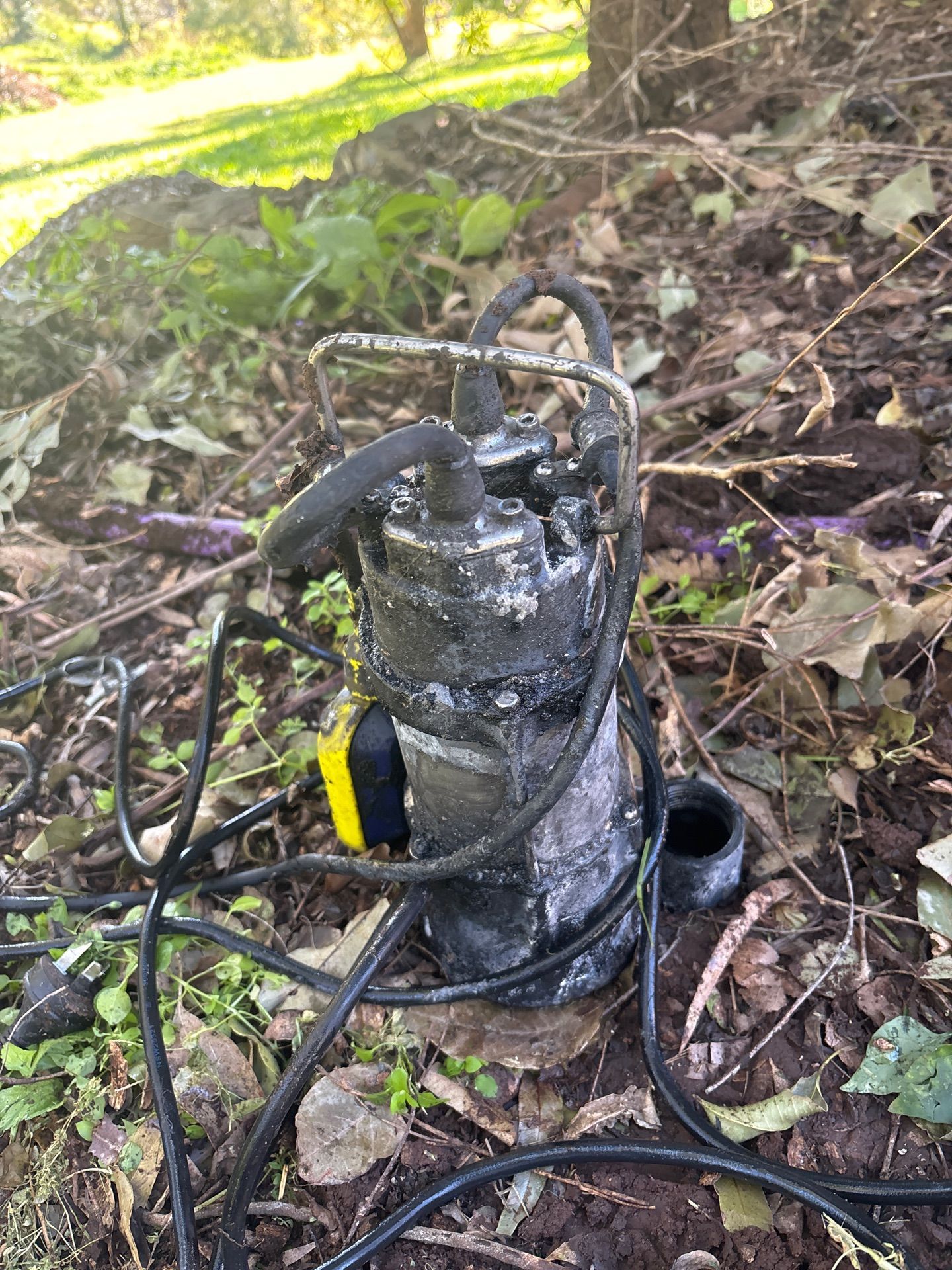 Burned Black Pump or Motor on a Dirt Slope — Shreks Septic Services in Oakey, QLD