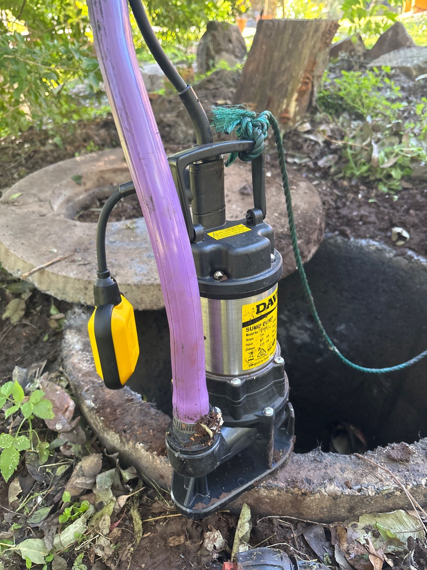 Portable Sump Pump in a Rocky Ground Hole — Shreks Septic Services in Murphys Creek, QLD