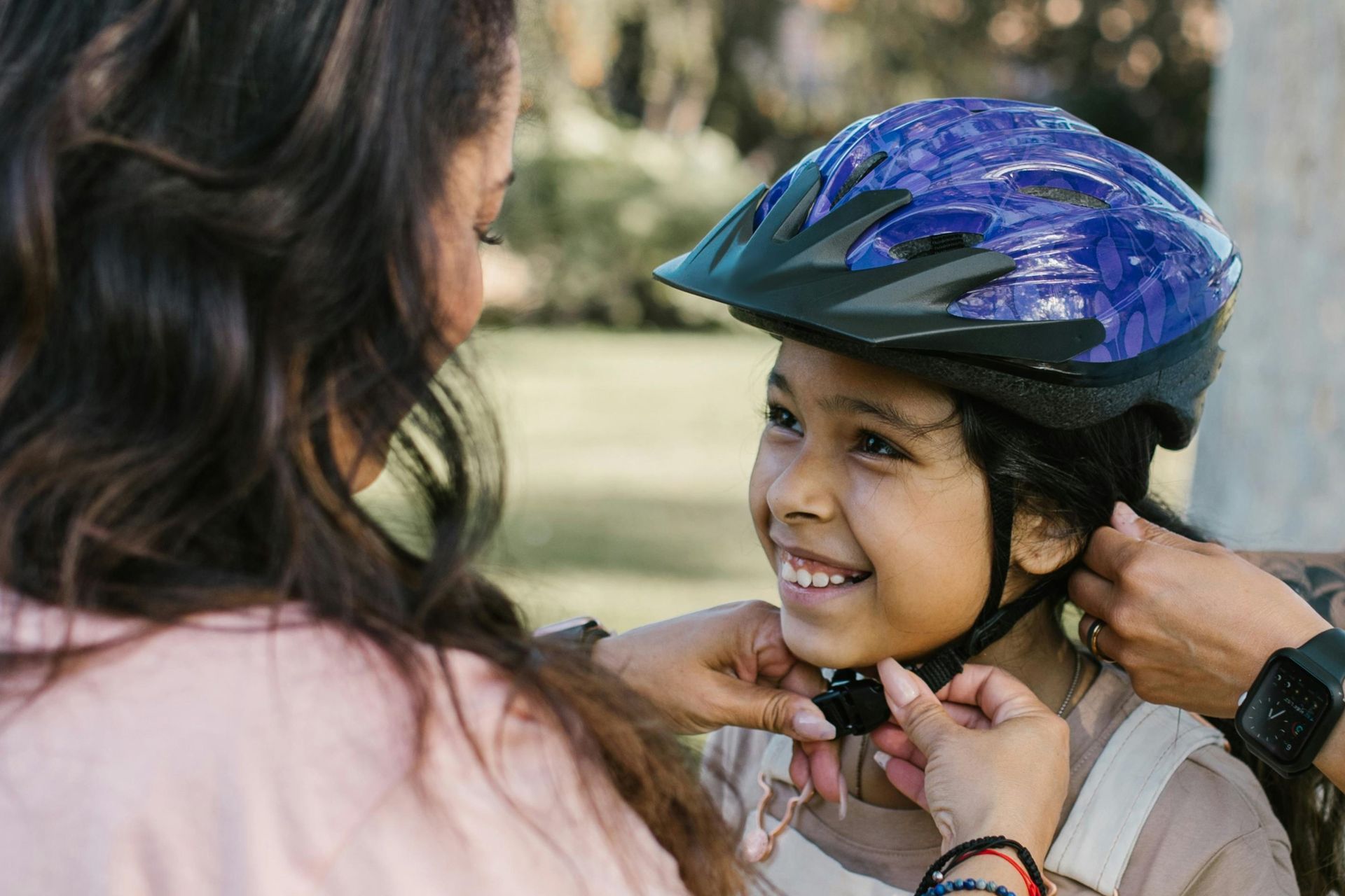 Mother and child with helmet photo for blog post Proper Helmet Use by Dr. Wiersma, pediatrician in Scottsdale, AZ