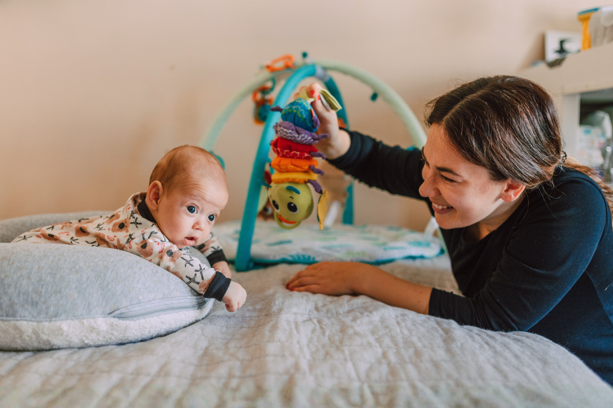 mother playing with her baby
