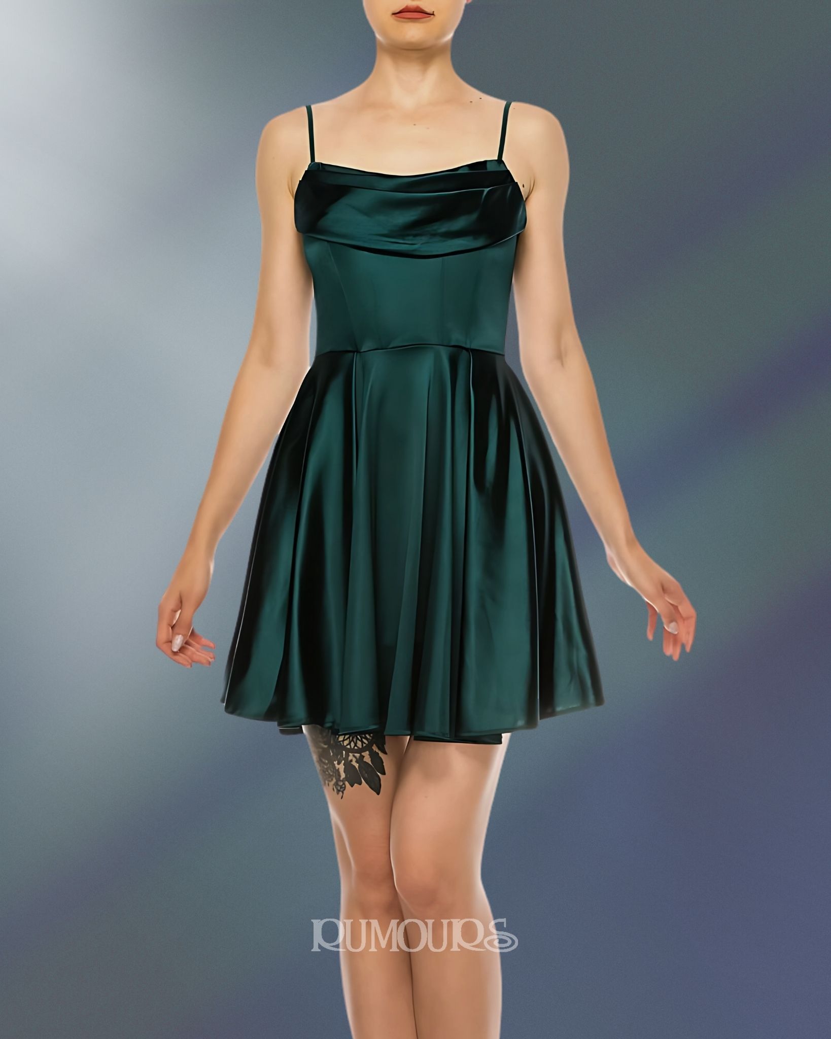 Woman wearing a dark green satin mini-dress, standing in front of a teal gradient background.