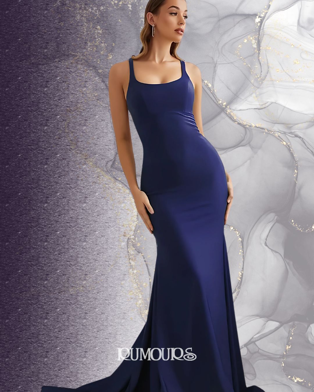 Woman in navy blue gown, standing against a swirling, marbled backdrop.