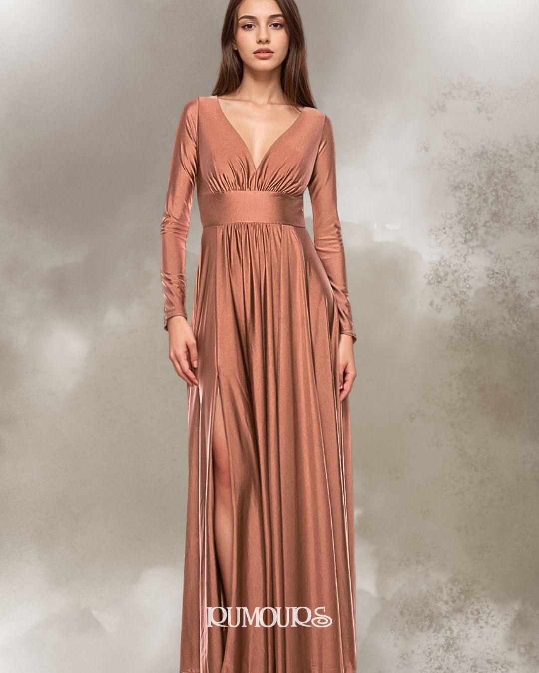 Woman in a flowing, terracotta-colored dress with long sleeves and a V-neck, standing.