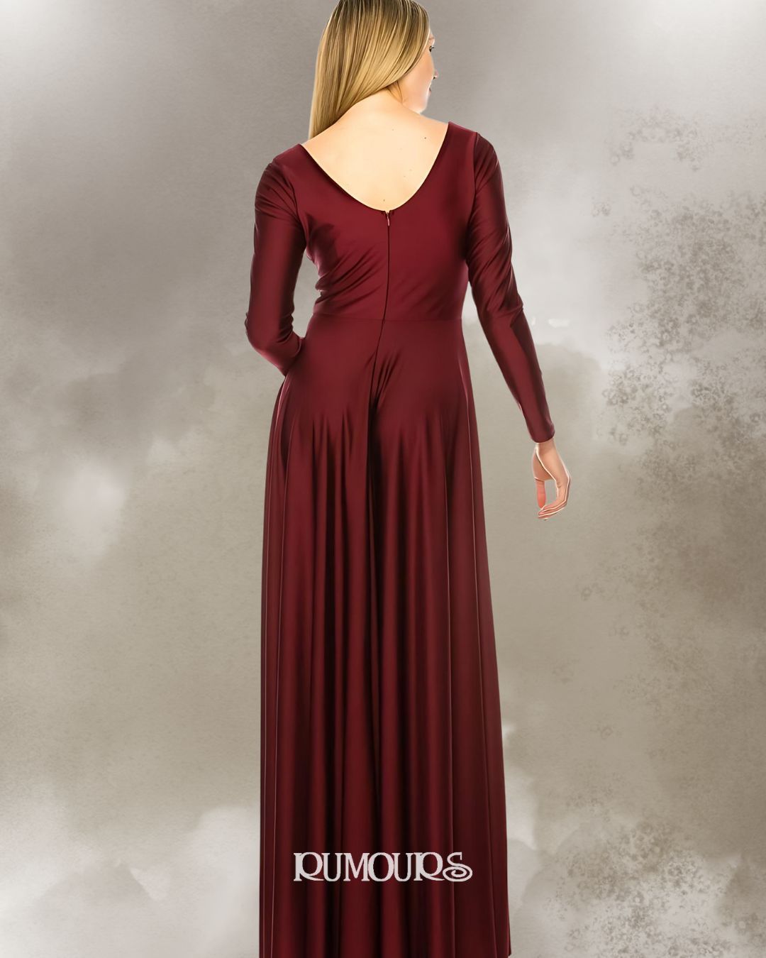 Woman in a long, burgundy dress with long sleeves, standing with her back to the camera.