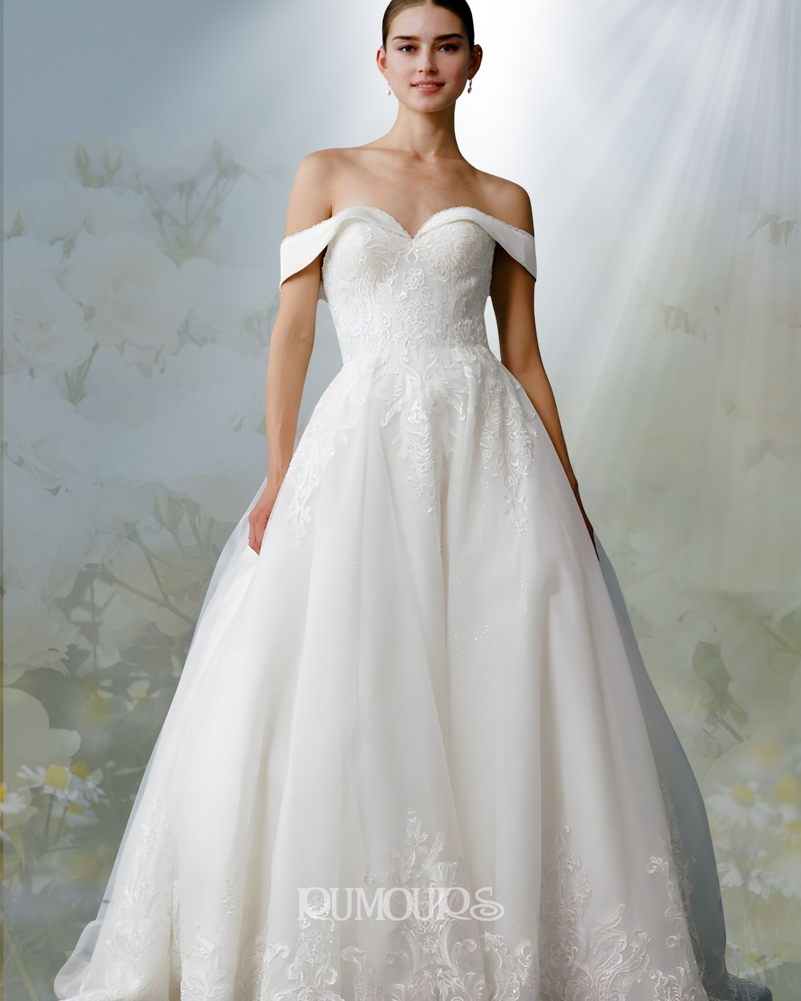 Woman in a white off-the-shoulder wedding dress smiles, standing in front of a soft, floral background.
