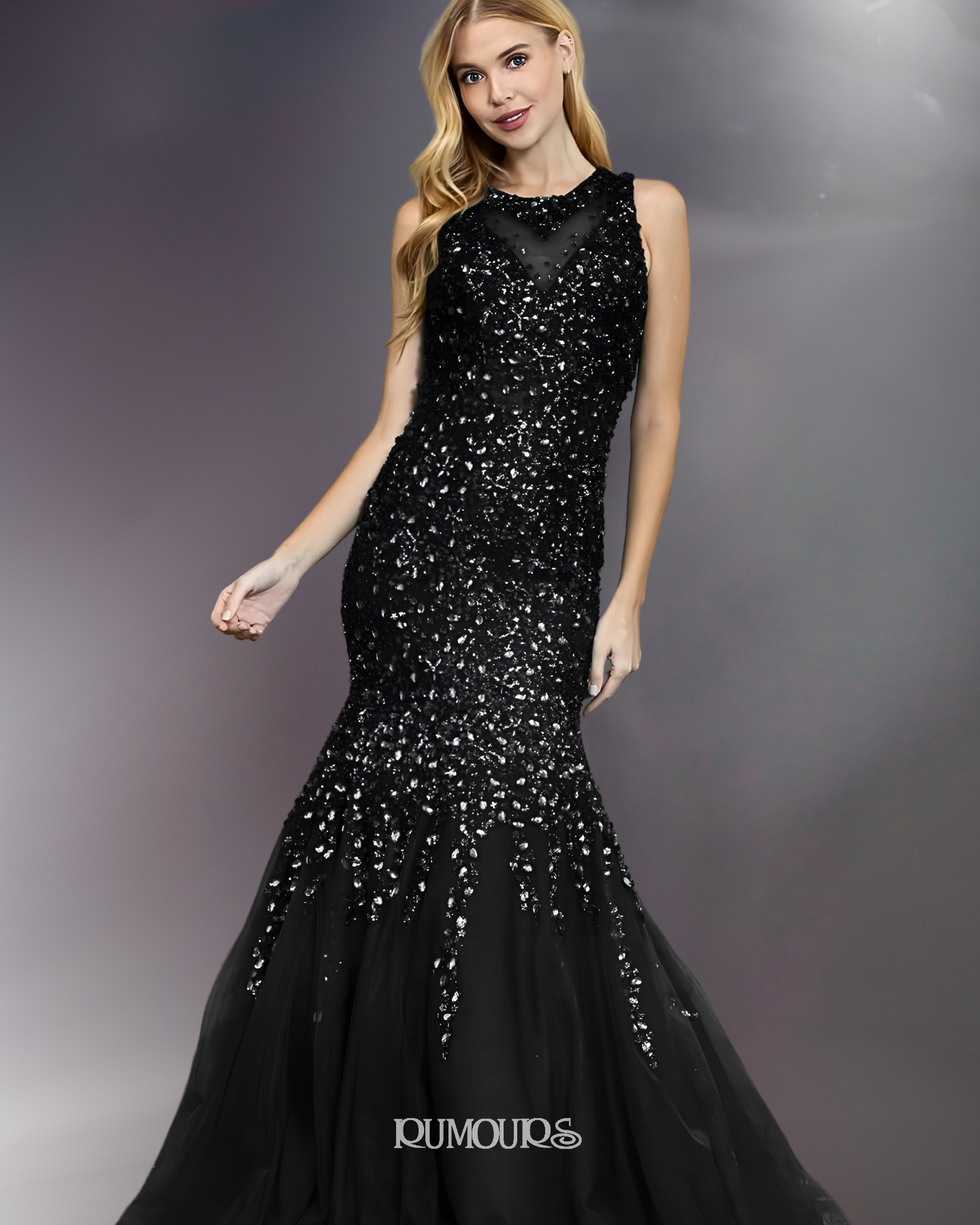 Woman in a black sequined mermaid gown posing against a blurred background.