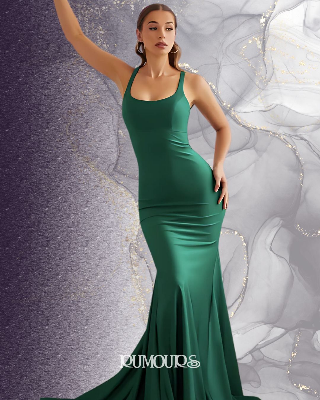 Woman in a green mermaid gown, arm raised, posing against an abstract background.