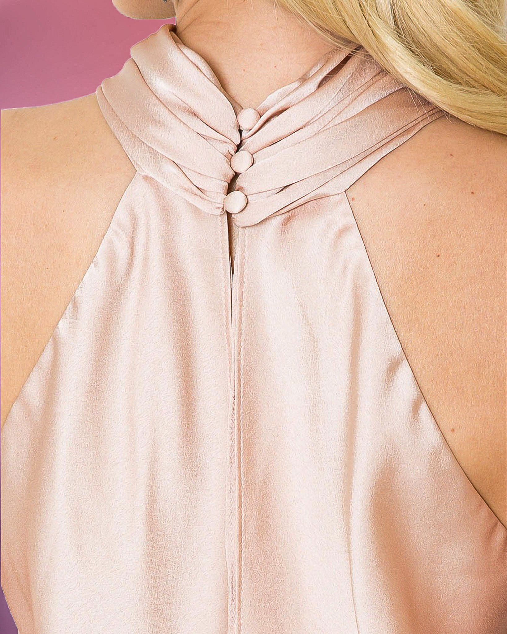 Back of a pink dress with a high, buttoned neckline.