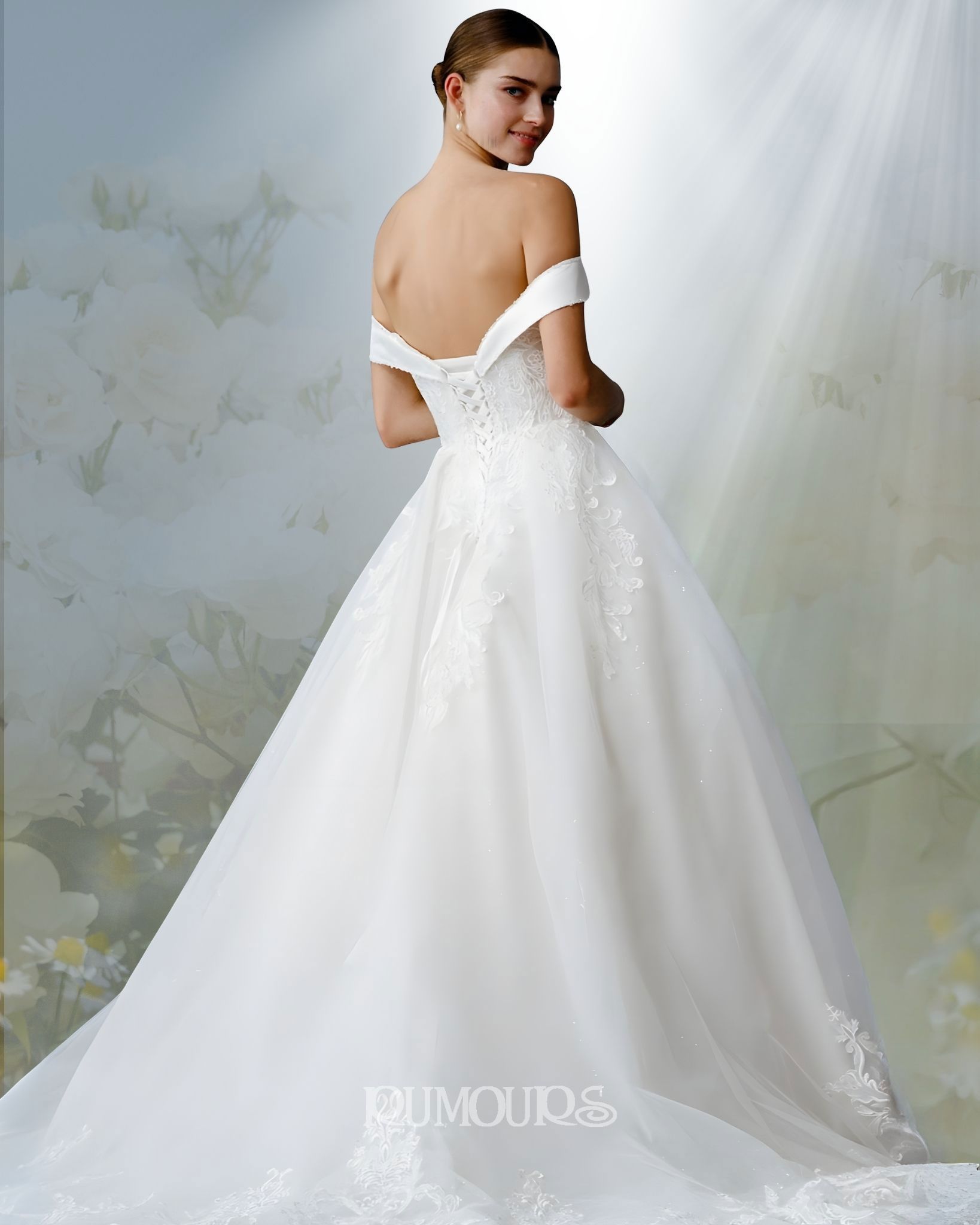 Woman in white off-the-shoulder wedding gown, facing away, looking over shoulder.