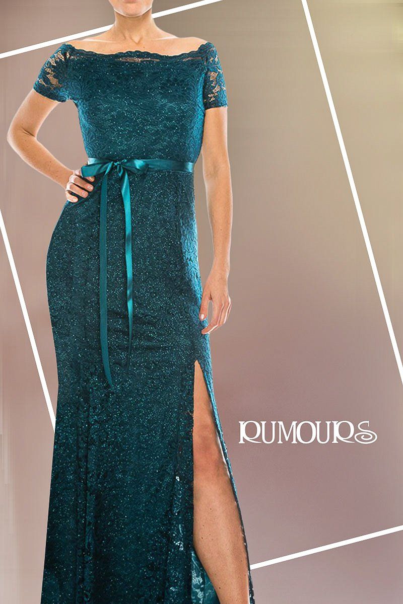 Woman in teal sequined gown, off-the-shoulder neckline, slit, and ribbon belt, standing against a gradient background.