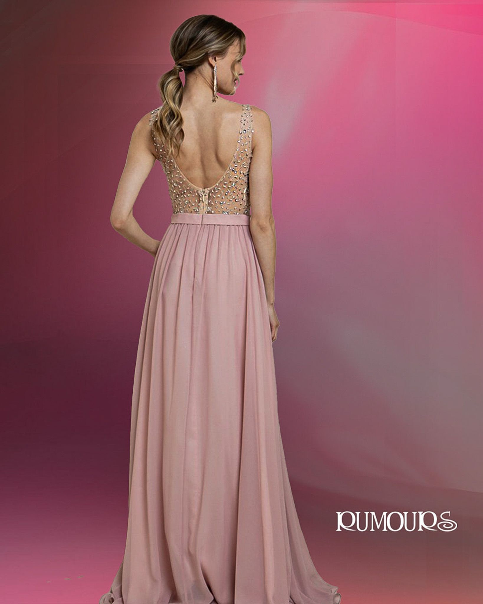 Woman in a dusty rose gown with jeweled bodice, standing with back to camera.