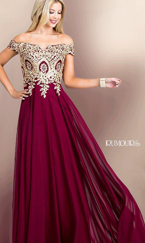 Woman in a burgundy off-the-shoulder gown with gold embroidered bodice, smiling.