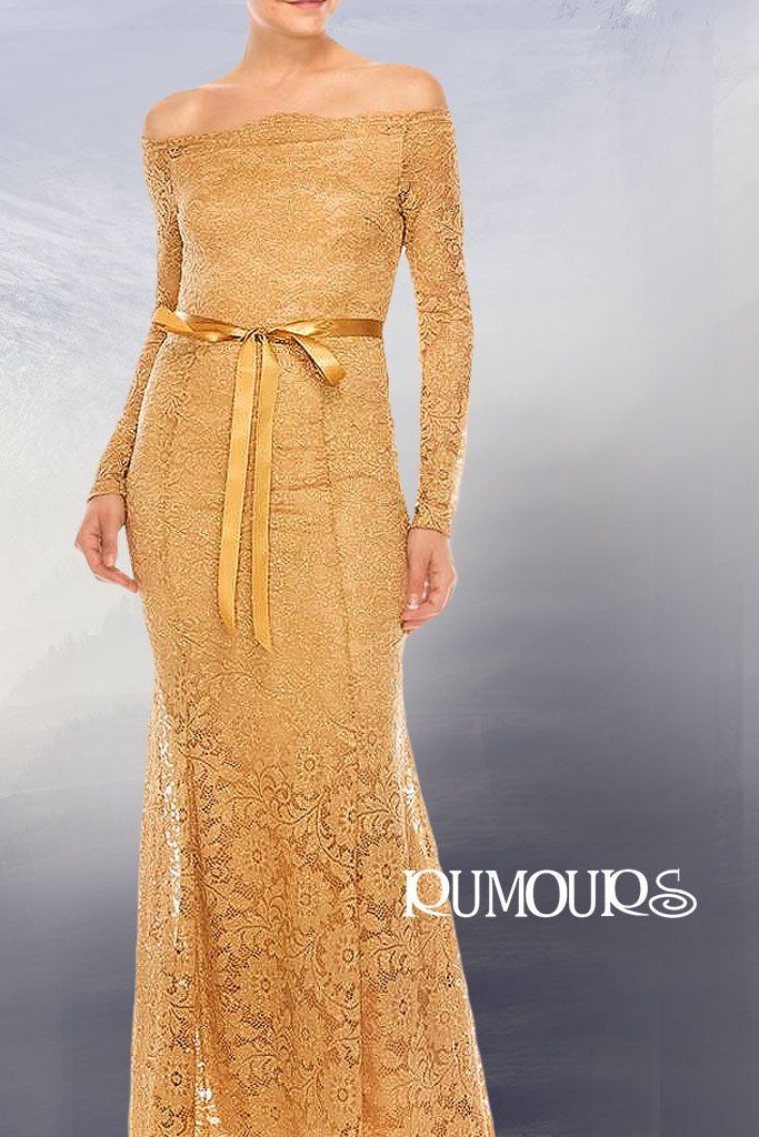 Woman in a gold off-the-shoulder gown with long sleeves and a matching ribbon belt.