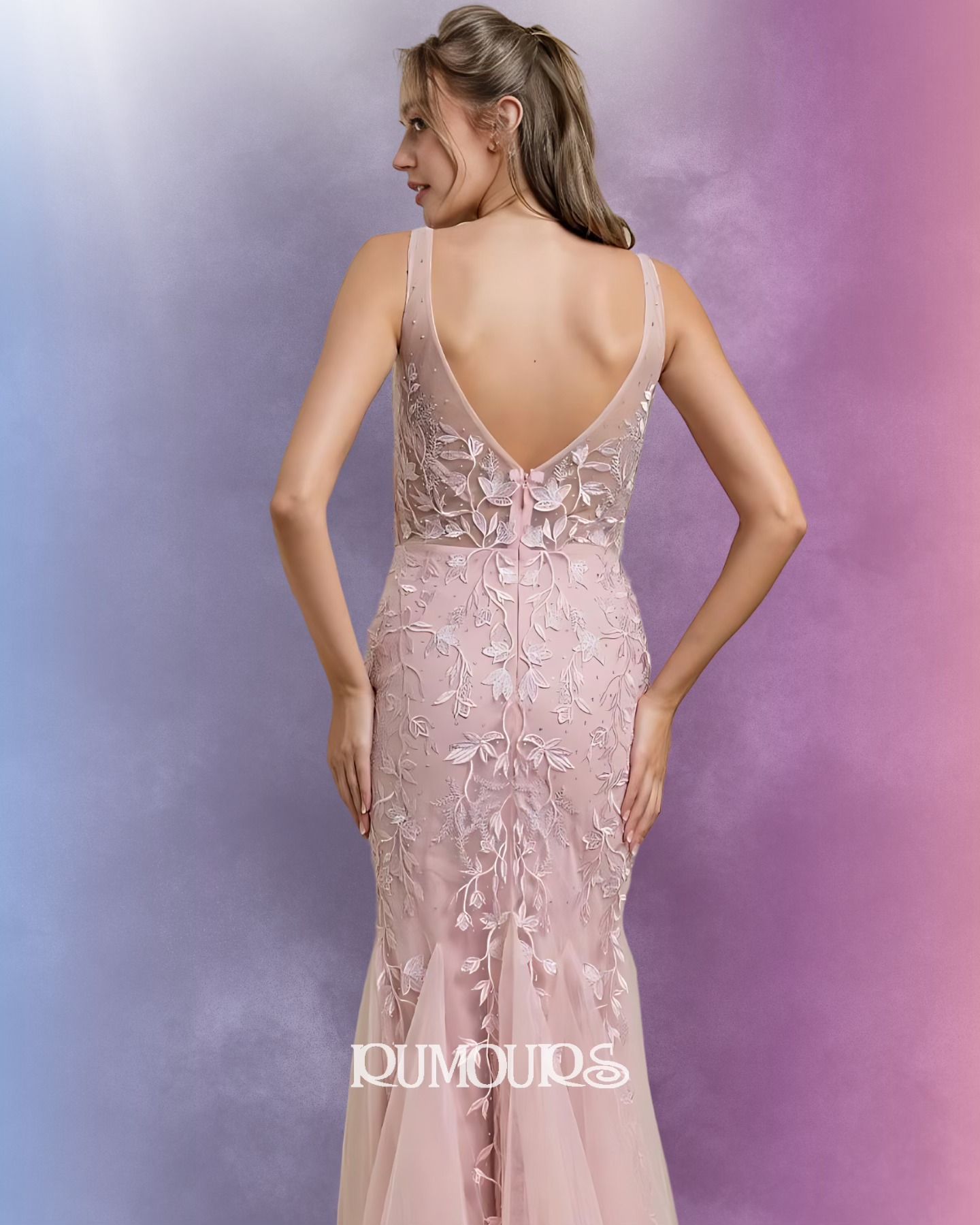 Woman in pink, beaded evening gown, back view.
