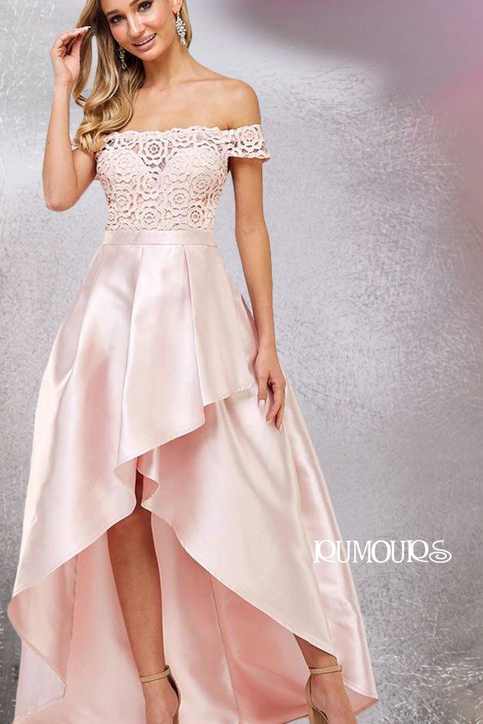 Woman in a blush pink, off-the-shoulder formal gown with a high-low skirt.