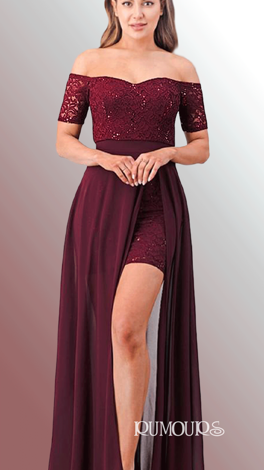 Woman in a burgundy off-the-shoulder dress with a thigh-high slit, posing in front of a gradient background.