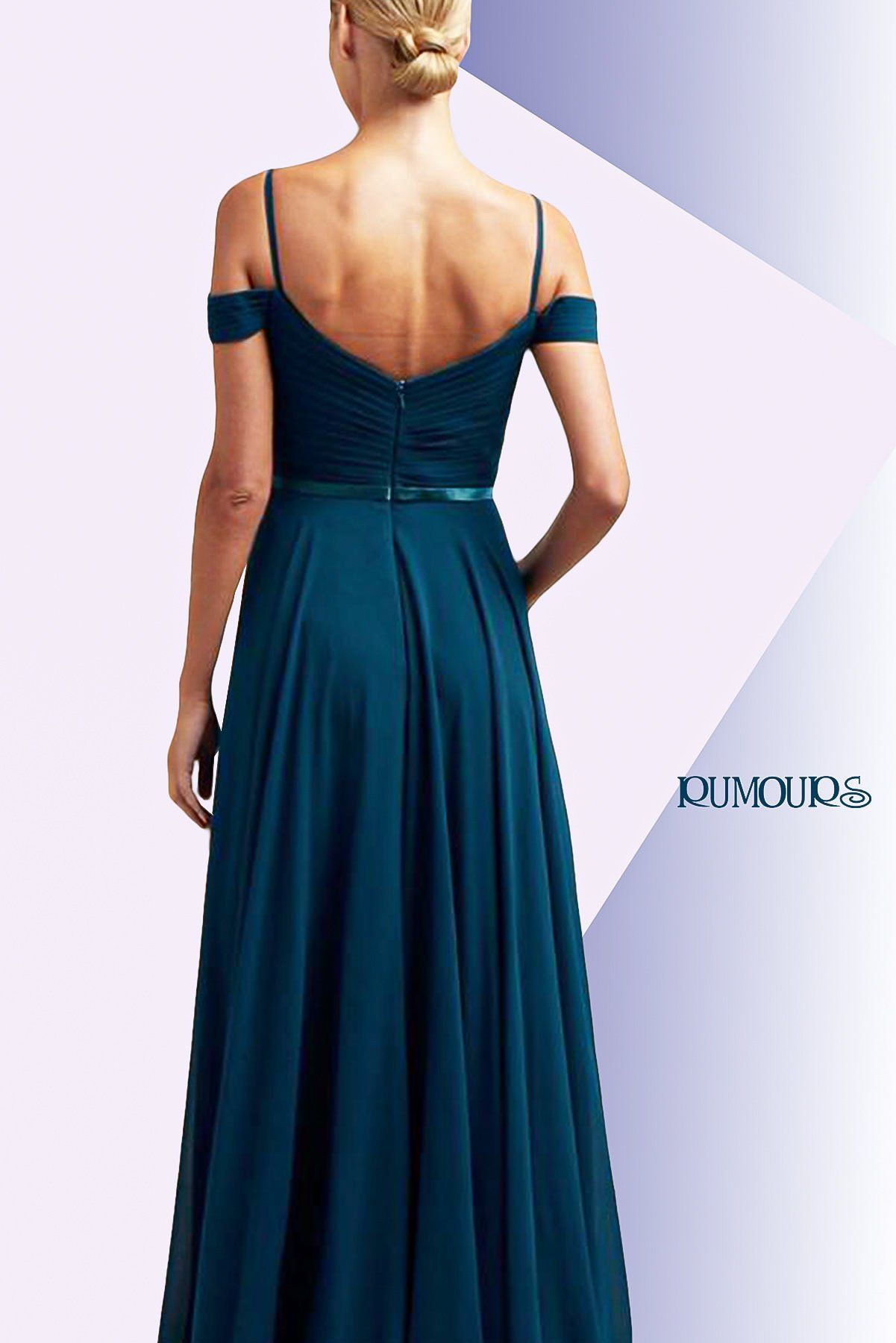 Woman in teal off-the-shoulder formal gown, standing against a geometric design backdrop.