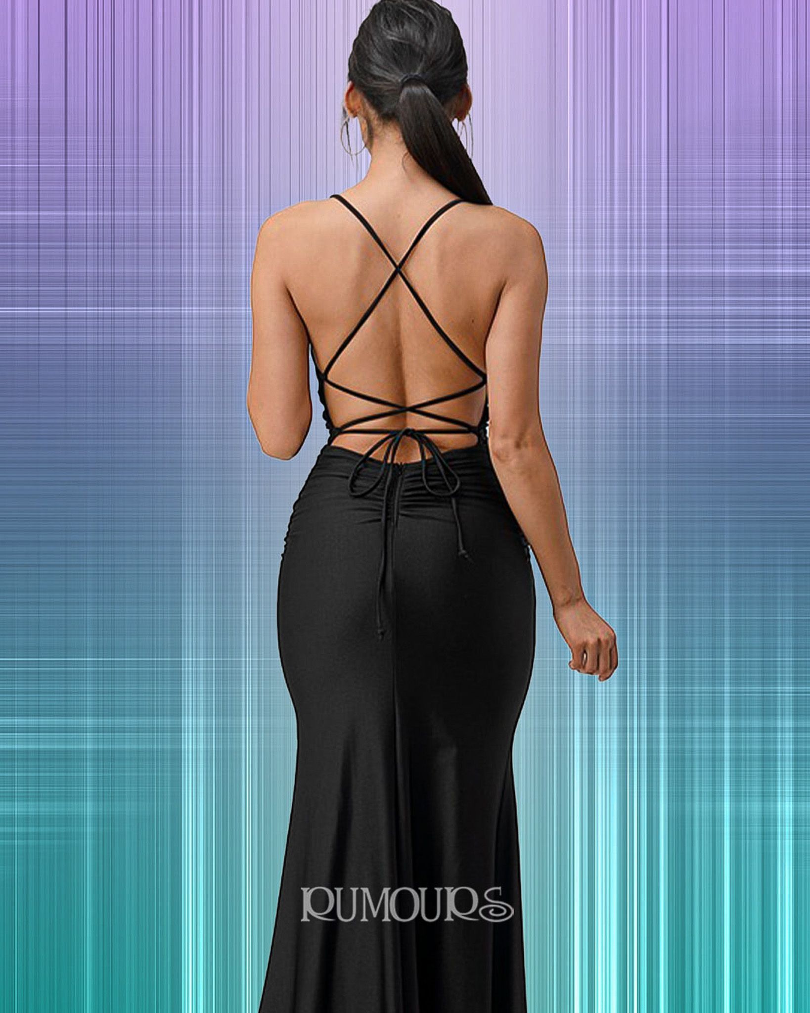 Woman in black backless formal gown with crisscross straps.