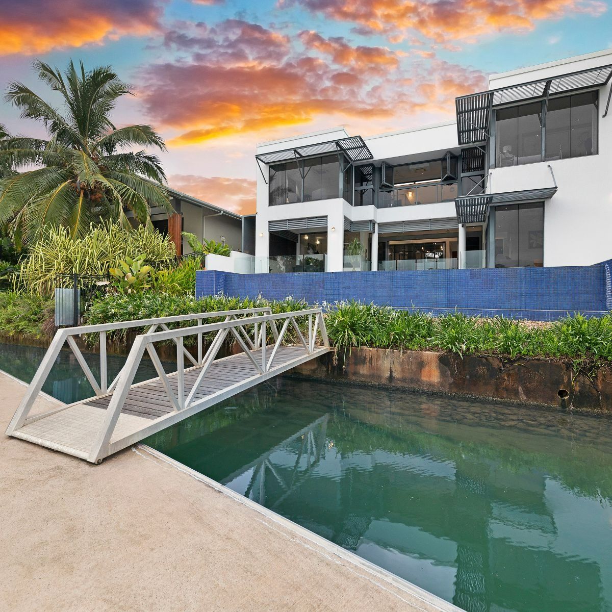 Large House With A Bridge Over A Body Of Water — Zen Luxury Retreats in Darwin City, NT