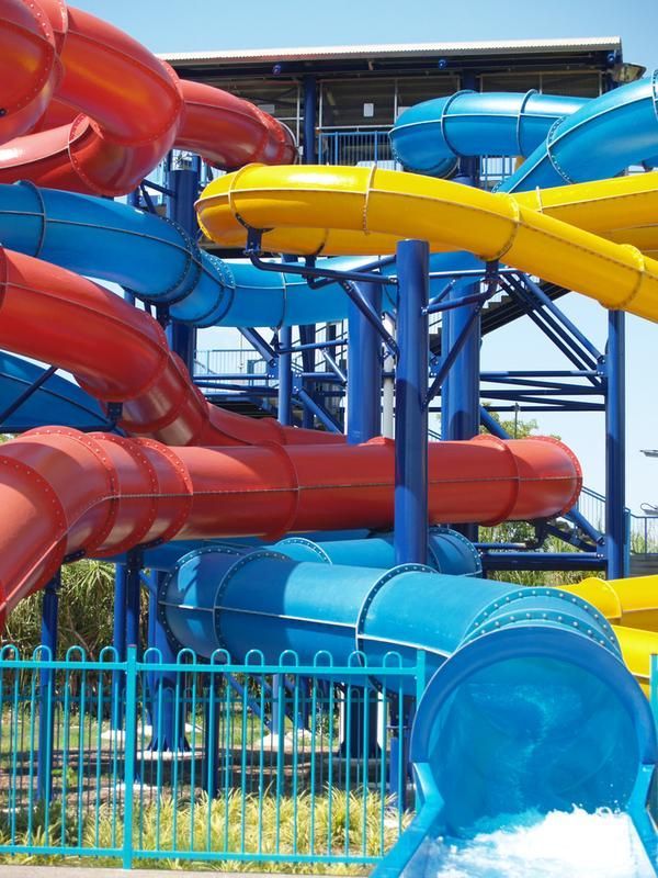 Long Red Green and Blue Waterslides — Zen Luxury Retreats in Darwin City, NT