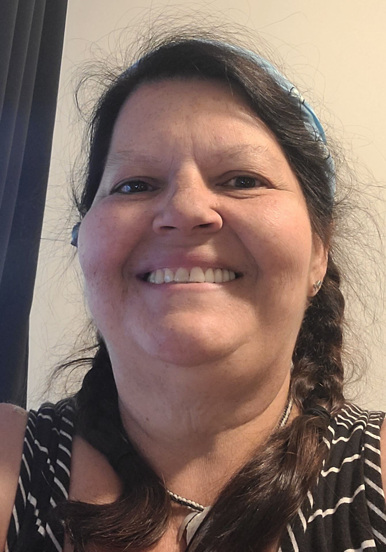 Person consulting with lawyer; documents on table; gavel nearby.