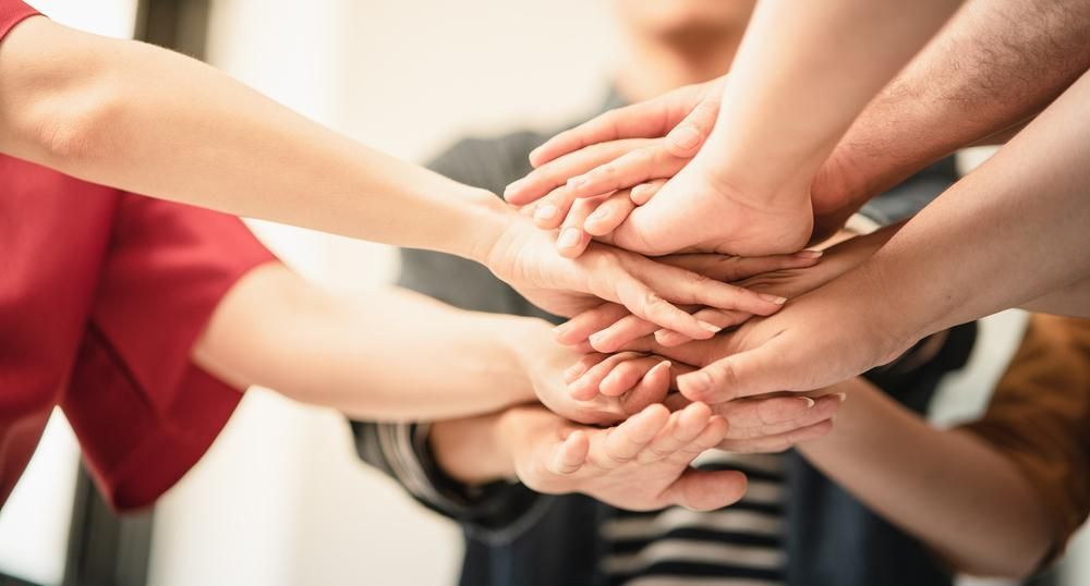 Group of People Are Putting Their Hands Together — Serenity Strides in Redbank Plains, QLD