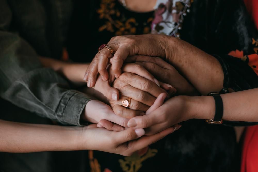 Group of People Are Holding Hands in a Circle — Serenity Strides in Redbank Plains, QLD