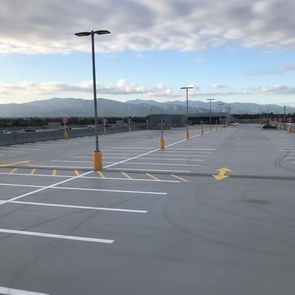 ADA parking garage striping in Peoria AZ with blue handicap spaces and access aisles