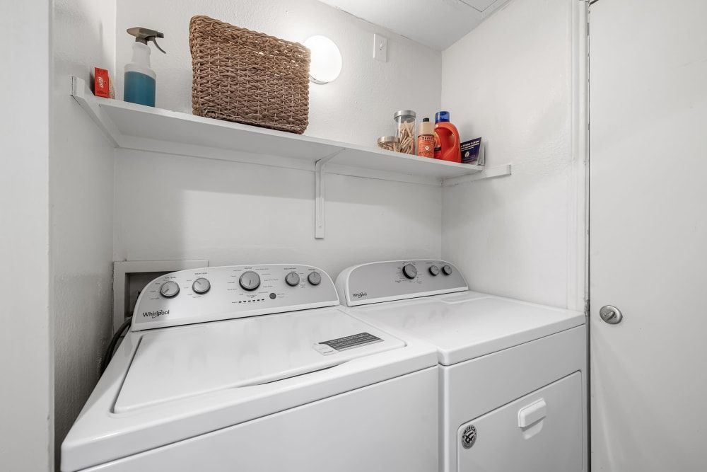 A washer and dryer in the laundry room at Marquis at Caprock Canyon in Austin, TX.