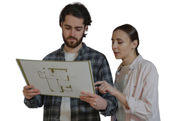 Two people looking at and discussing a floor plan document against a plain white background.