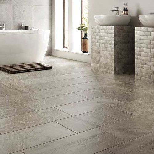 A bathroom with two sinks and a bathtub.