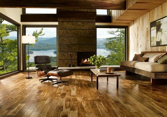 A living room with hardwood floors and a fireplace
