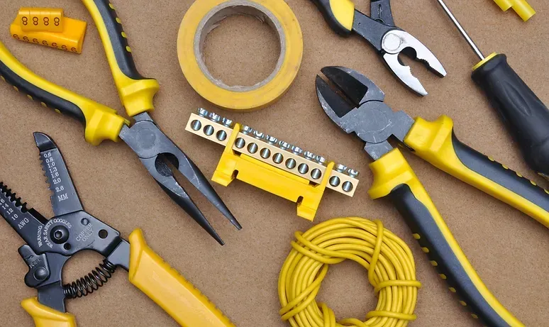 A bunch of yellow and black tools on a table
