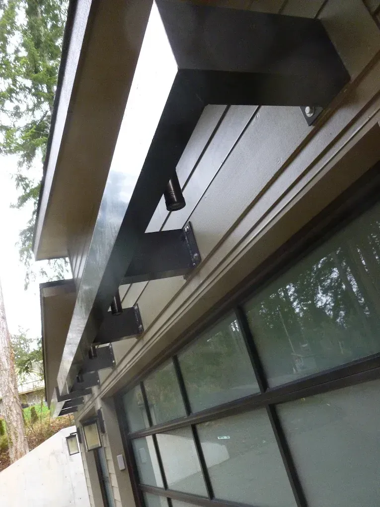 Exterior structural steel beam installed along building overhang