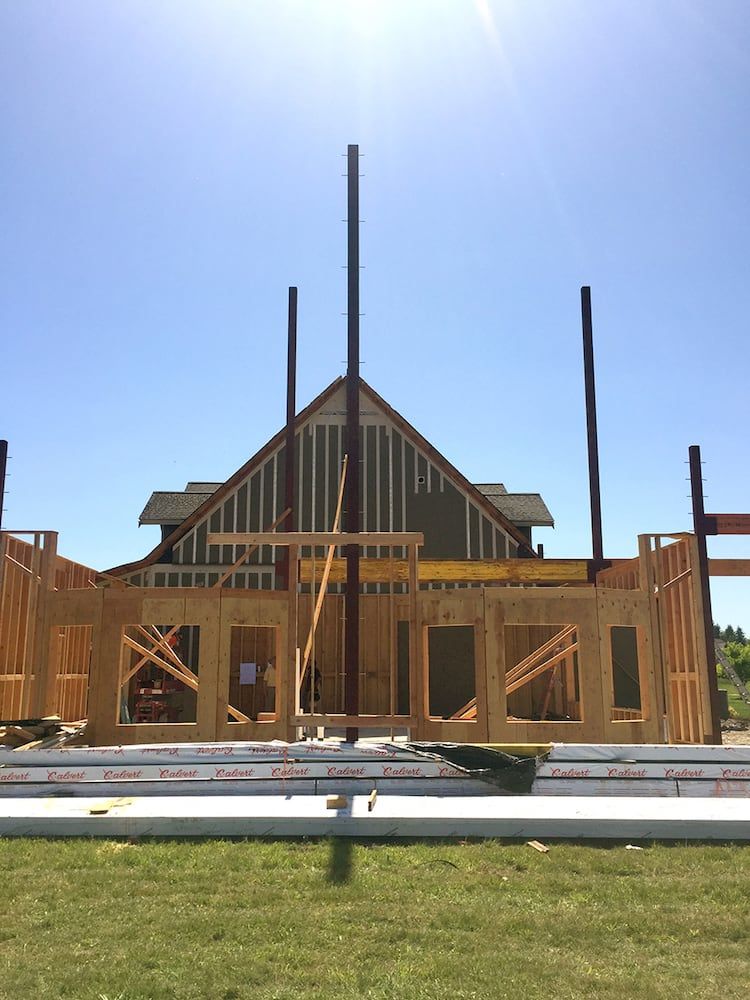 Structural steel beam installation integrated into residential building frame