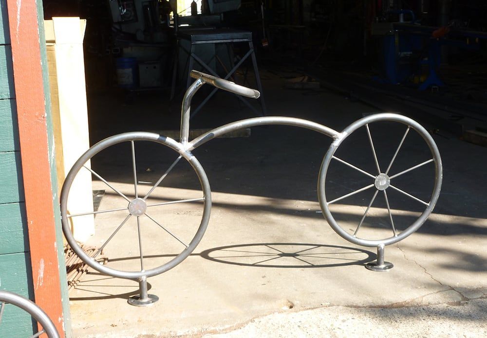 Custom fabricated steel bicycle rack with welded metal design
